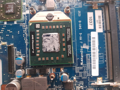 Close-up of a computer motherboard with various components.