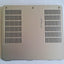 Silver RAM memory cover for Dell XPS 15 laptop, showing the back side with multiple ventilation holes.